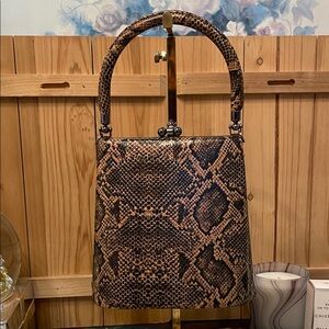 Snake-Print Top Handle Bag in Brown with detachable crossbody strap.